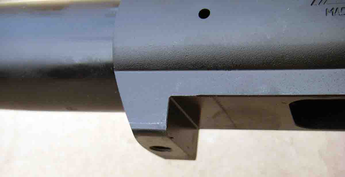 The recoil lug is integral to the flat bottom receiver.